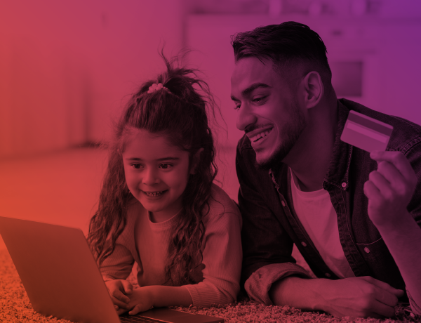 father teaching daughter how to use credit card online