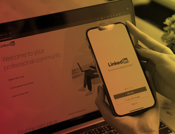 phone and laptop displaying linkedin