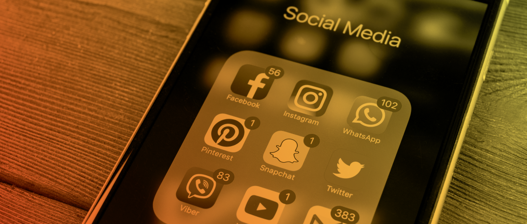 cellphone with social icons on the screen