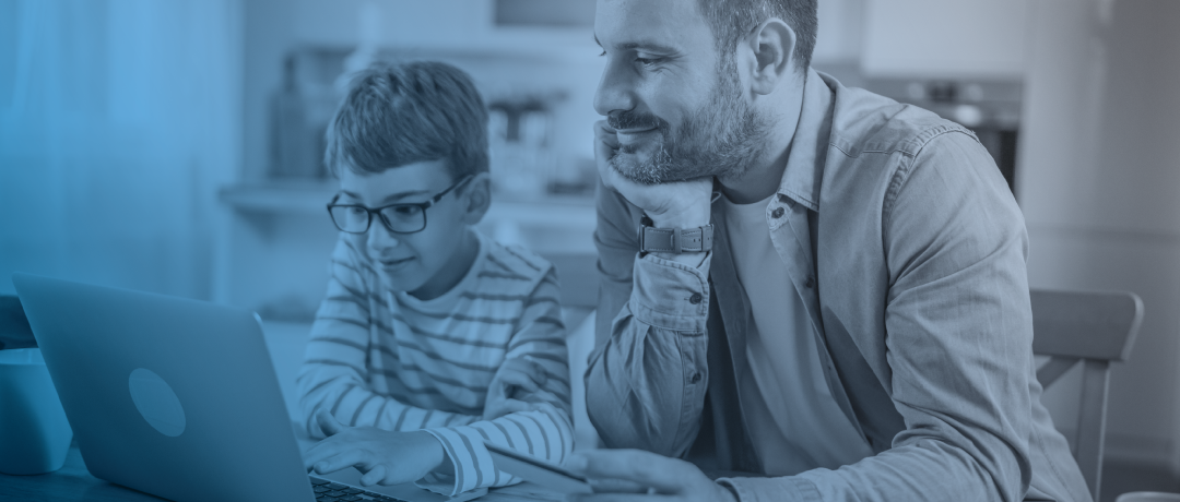dad teaching son how to use credit card online
