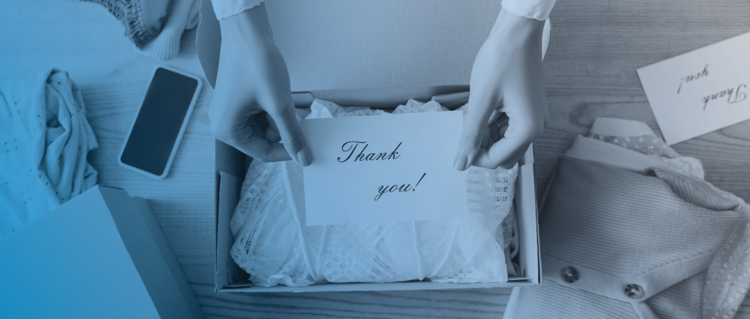 business owner putting thank you note in shipping box
