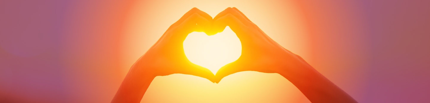 Hand heart around sun