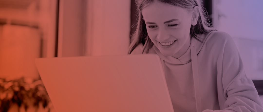 teen girl working at laptop