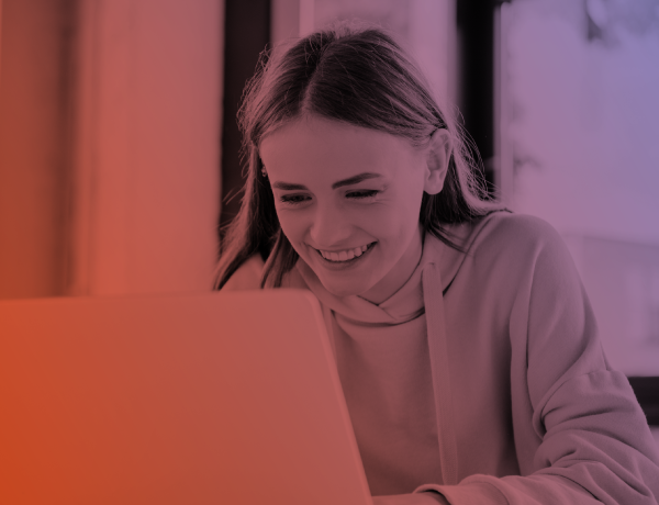 teen girl working at laptop