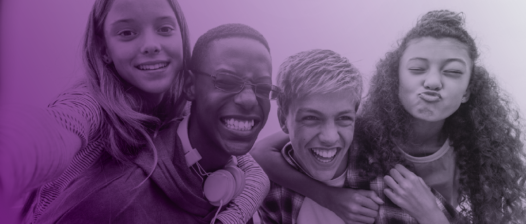 Group of teenagers smiling for the camera