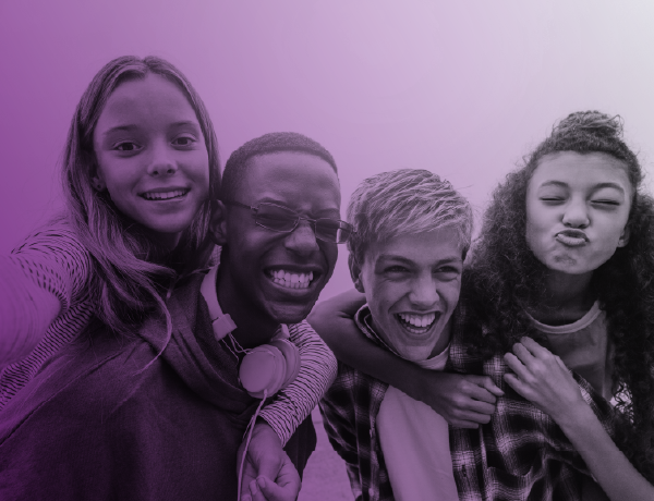Group of teenagers smiling for the camera