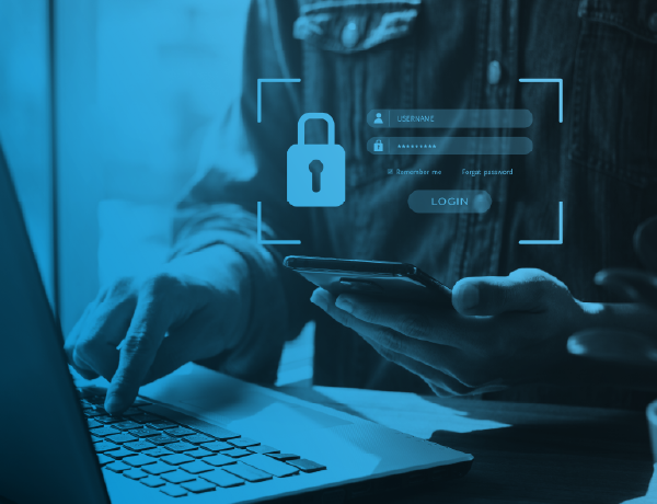 person using laptop and phone with secure lock on