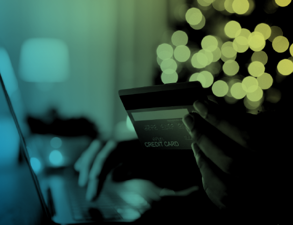 person using credit card on laptop